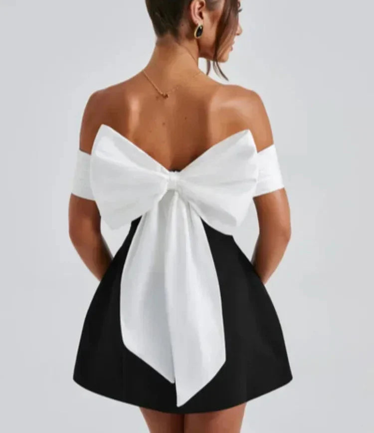 Neliza | Glamourös Off-Shoulder Klänning – Stor Båge För Festliga Tillfällen 6