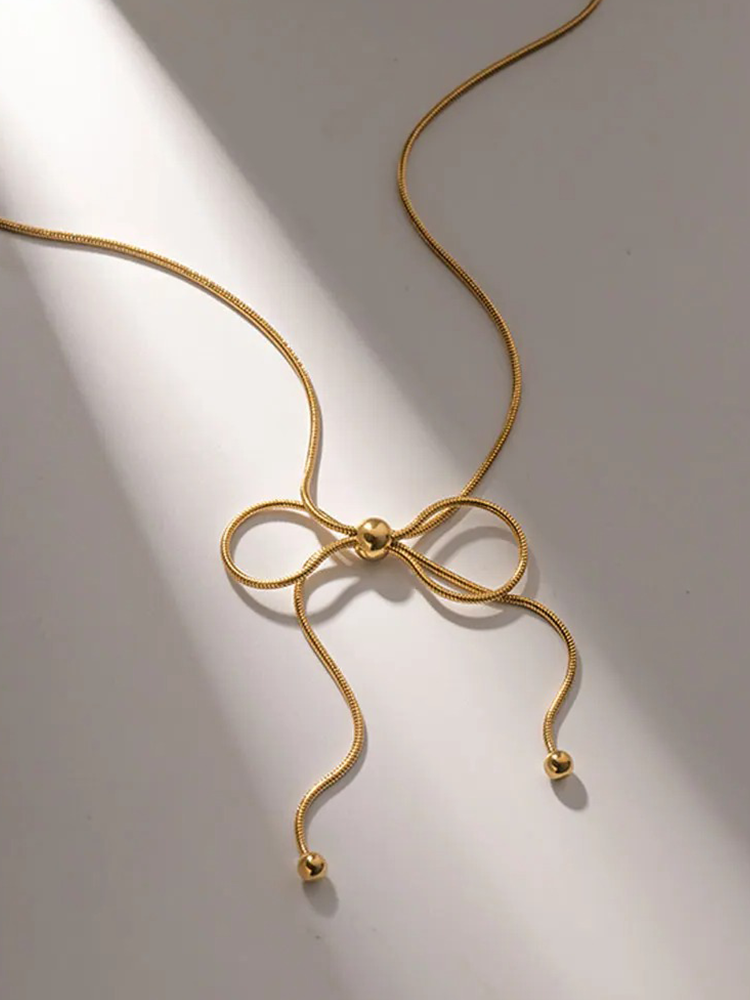 Ysabel | Elegant Guldormhalsband – Delikat Bågdesign för Stiliga Tillfällen 2