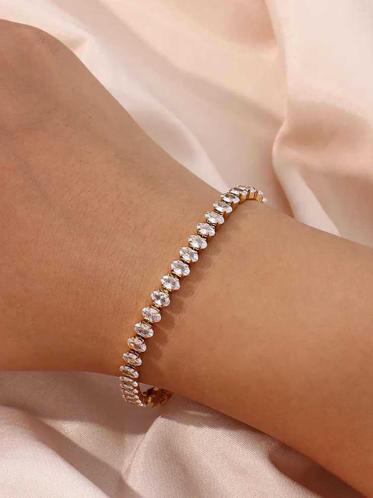 Norah | Elegant Tennisarmband – Ovala Stenar i Guld 1