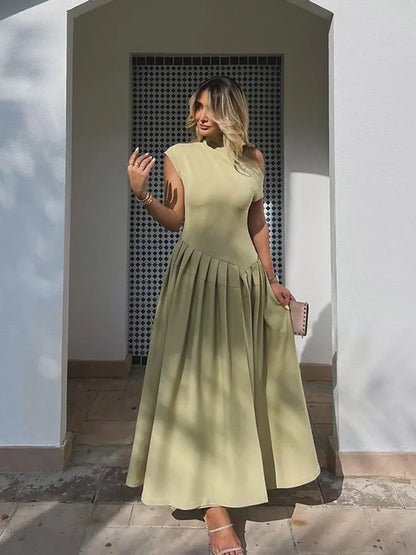 Irena | Elegant Sommarklänning Dam – Rygglös Med Asymmetrisk Ruffle 1